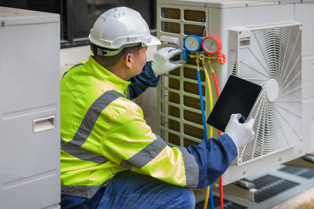 Professional Heat Pump Repair technician working in Paige, TX